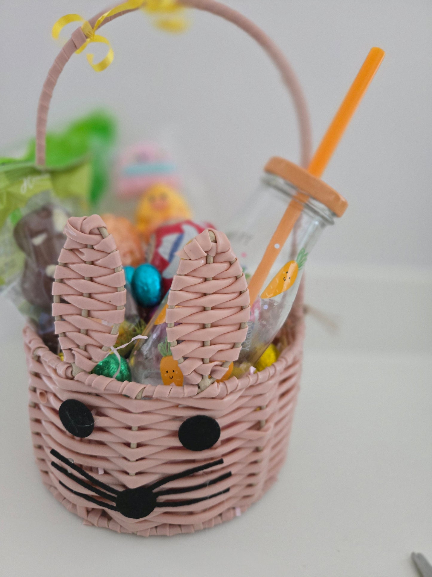 Filled Easter wicker basket Easter hamper filled with easter theme sweets and chocolate