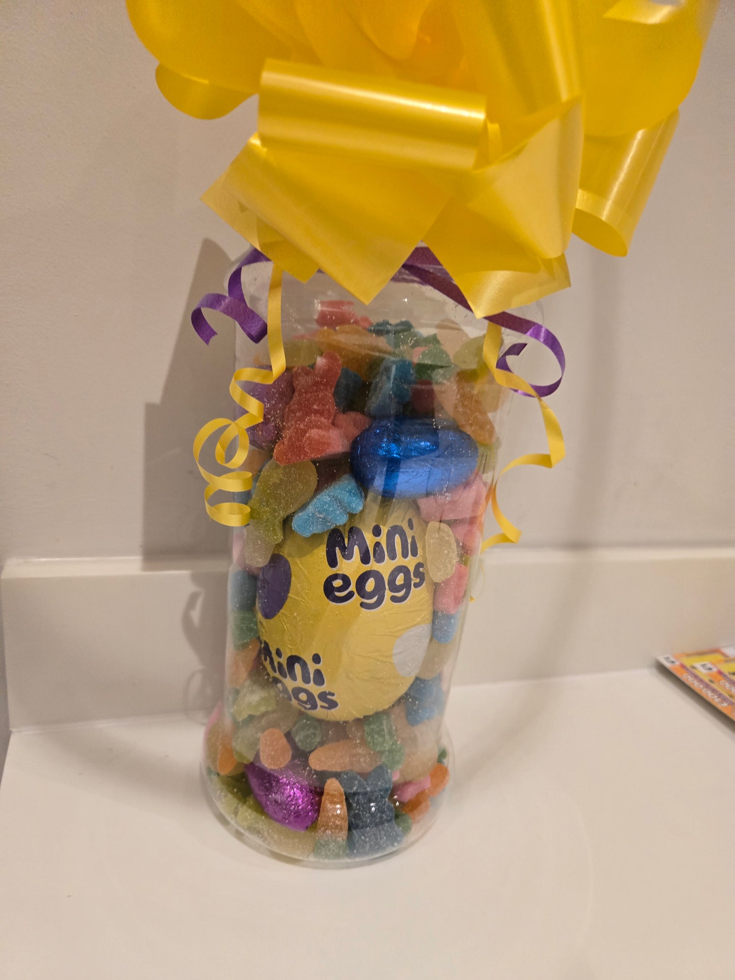 Easter sweetie jar with chocolate egg and sweets variety