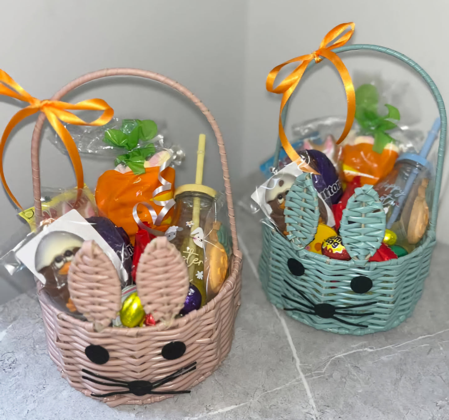 Filled Easter wicker basket Easter hamper filled with easter theme sweets and chocolate