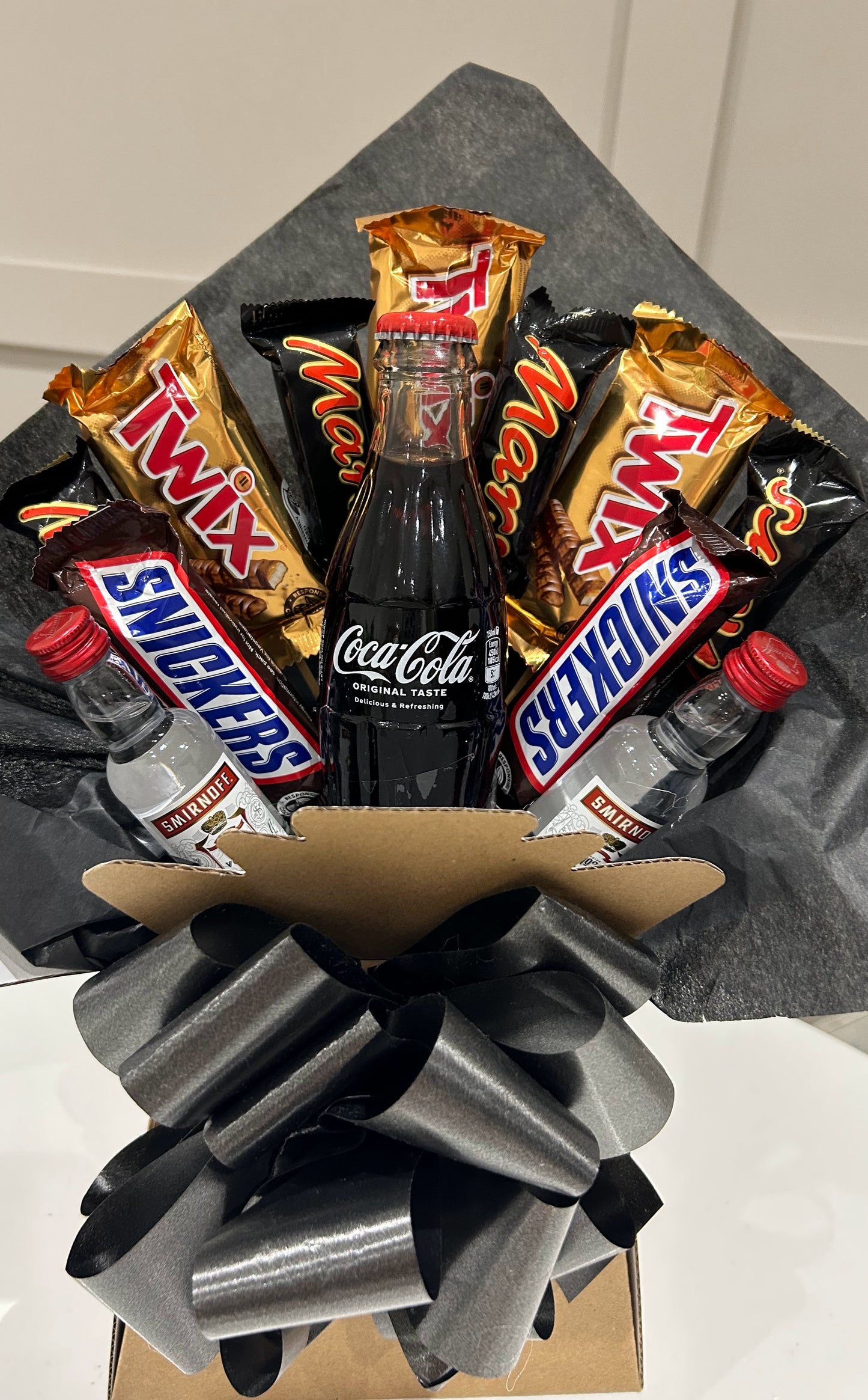 Smirnoff vodka, Coca Cola and nestle chocolate bouquets
