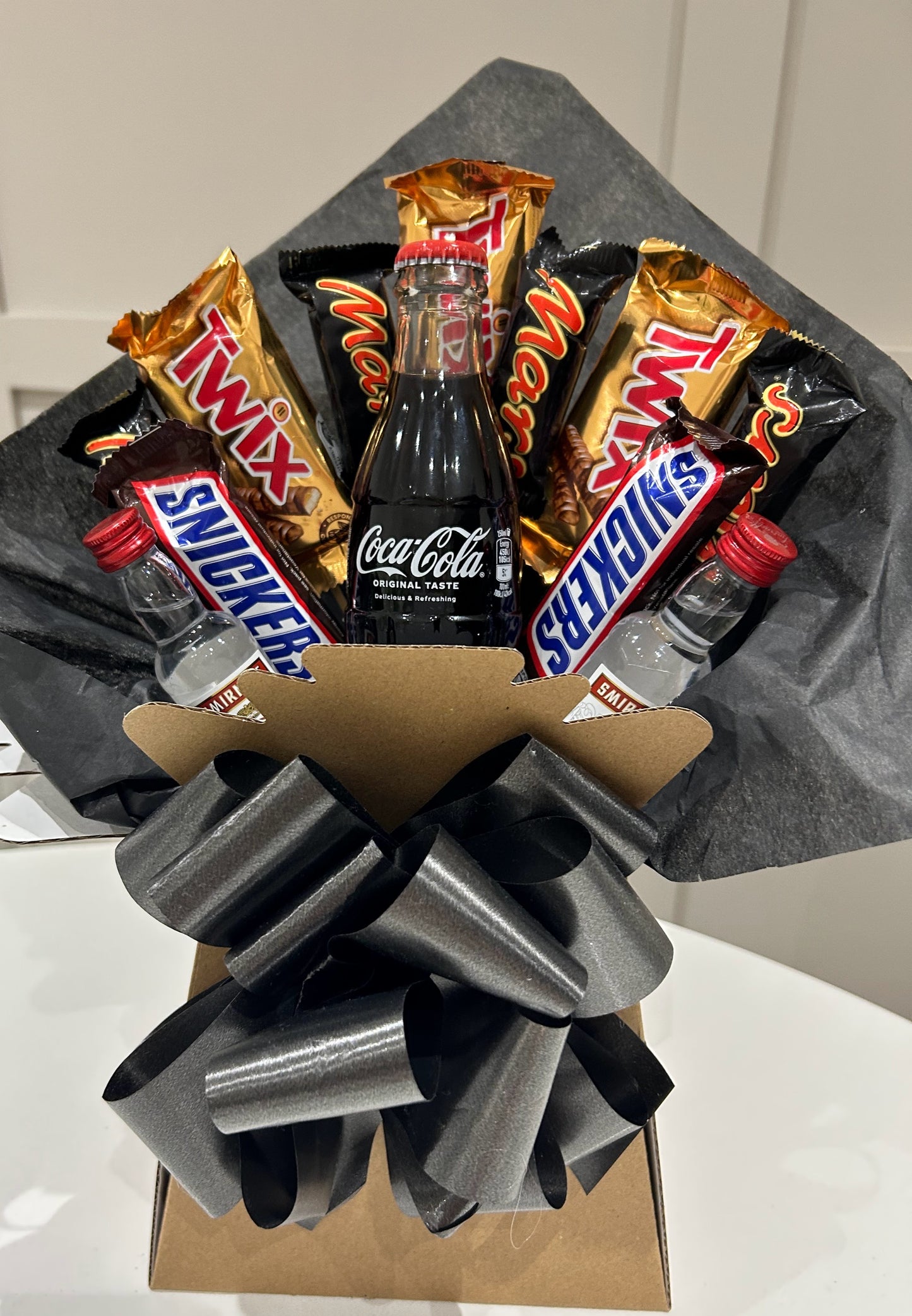 Smirnoff vodka, Coca Cola and nestle chocolate bouquets