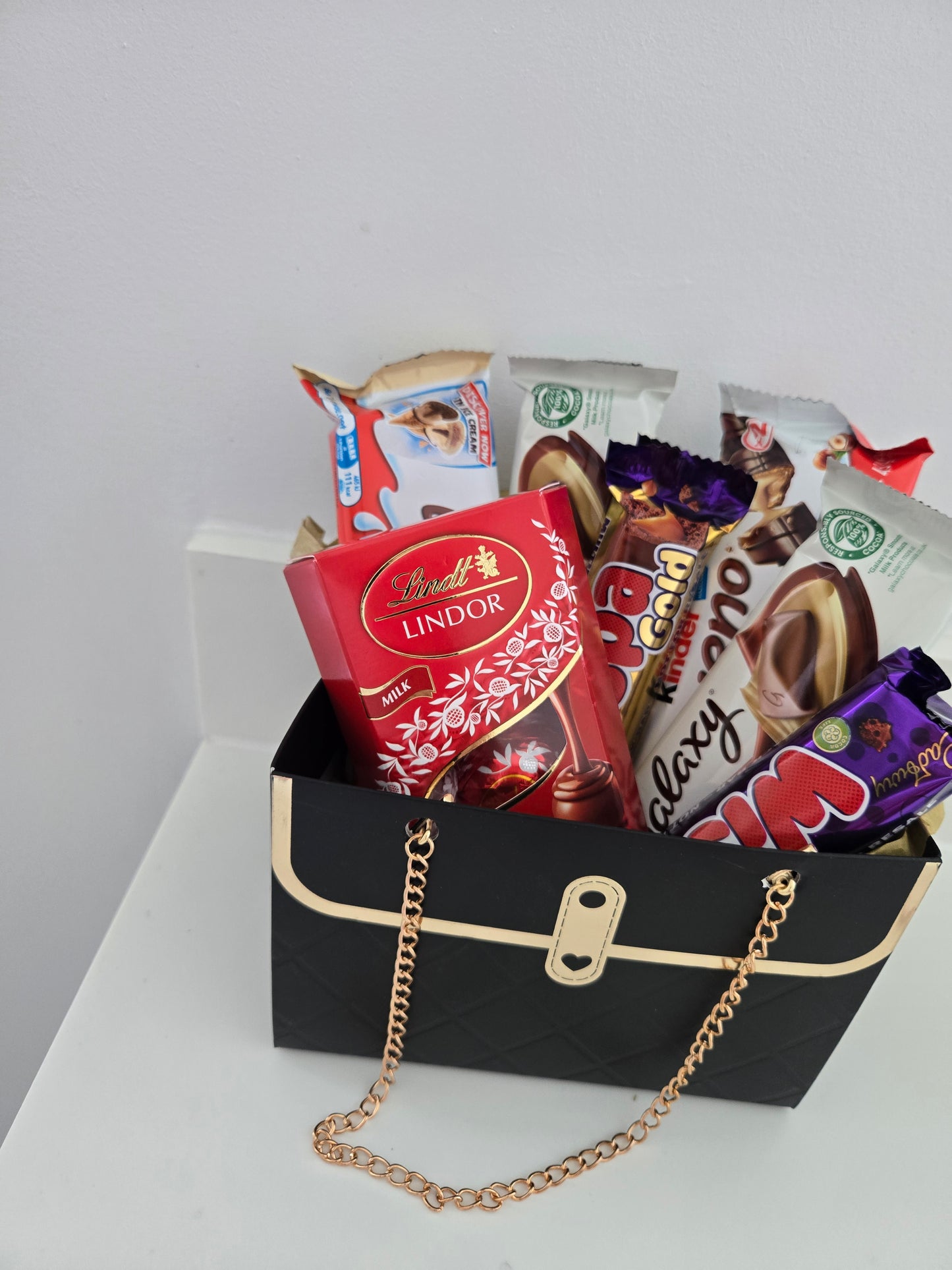 Handbag hamper filled with Variety of chocolate bars