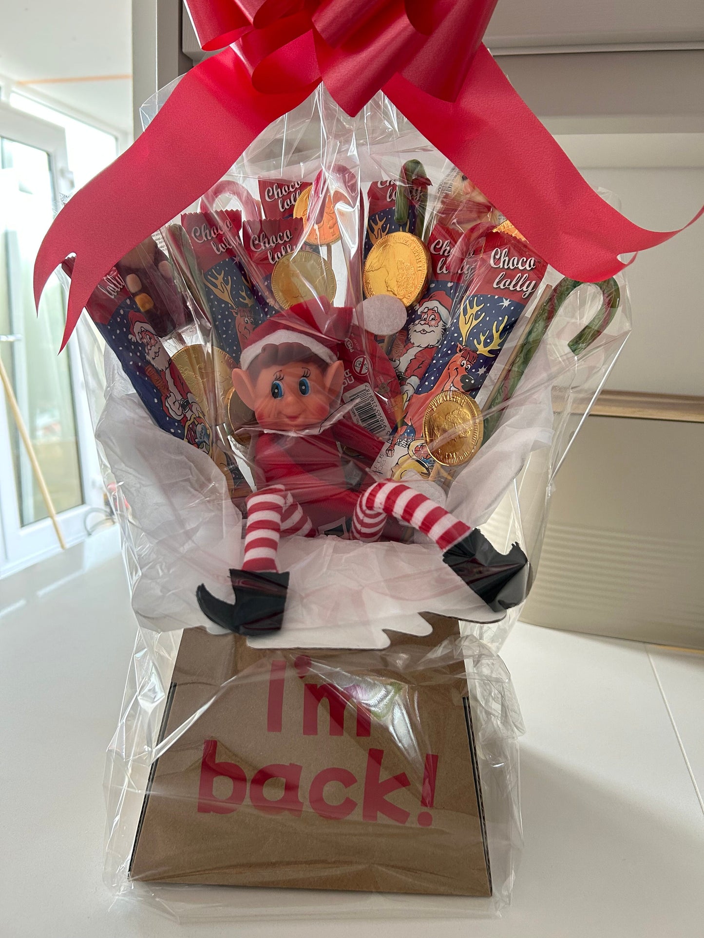Elf bouquet with naughty elf and Christmas theme sweets and chocolates