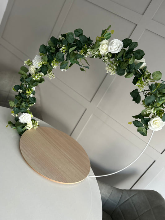 Rustic or light wood eucalyptus, Gypsophila and white and ivory roses Cake hoop and stand