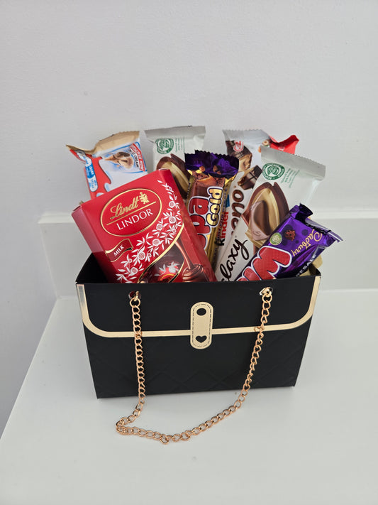 Handbag hamper filled with Variety of chocolate bars