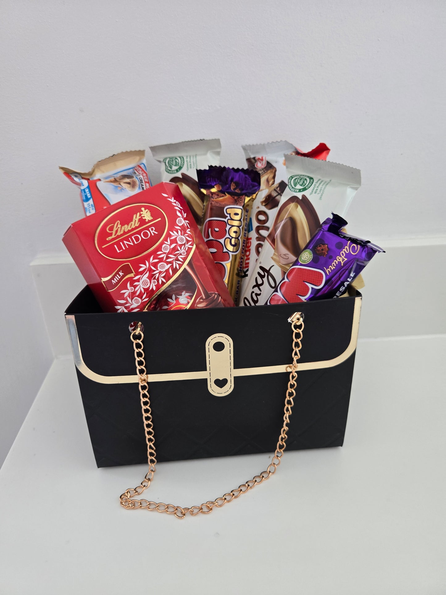 Handbag hamper filled with Variety of chocolate bars