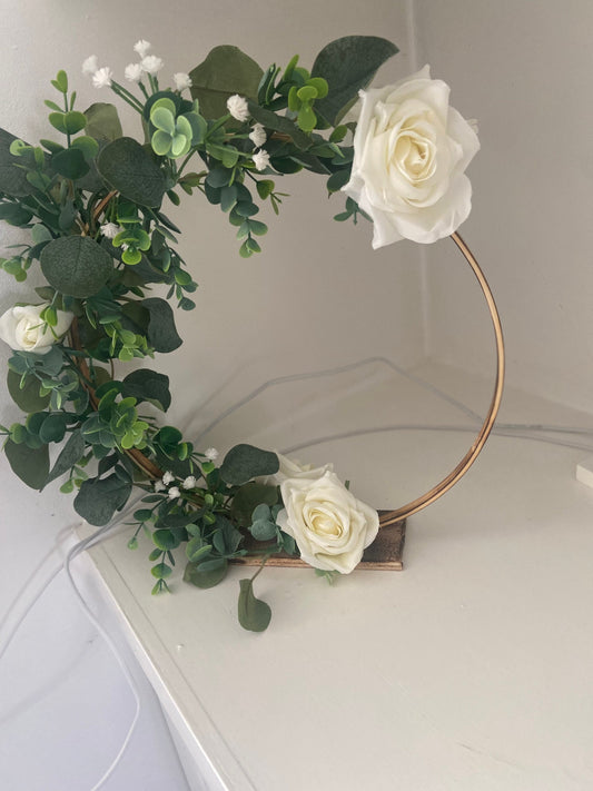 Beautiful rustic wedding centrepieces with eucalyptus, gypsophila and roses with hanging tealight holders