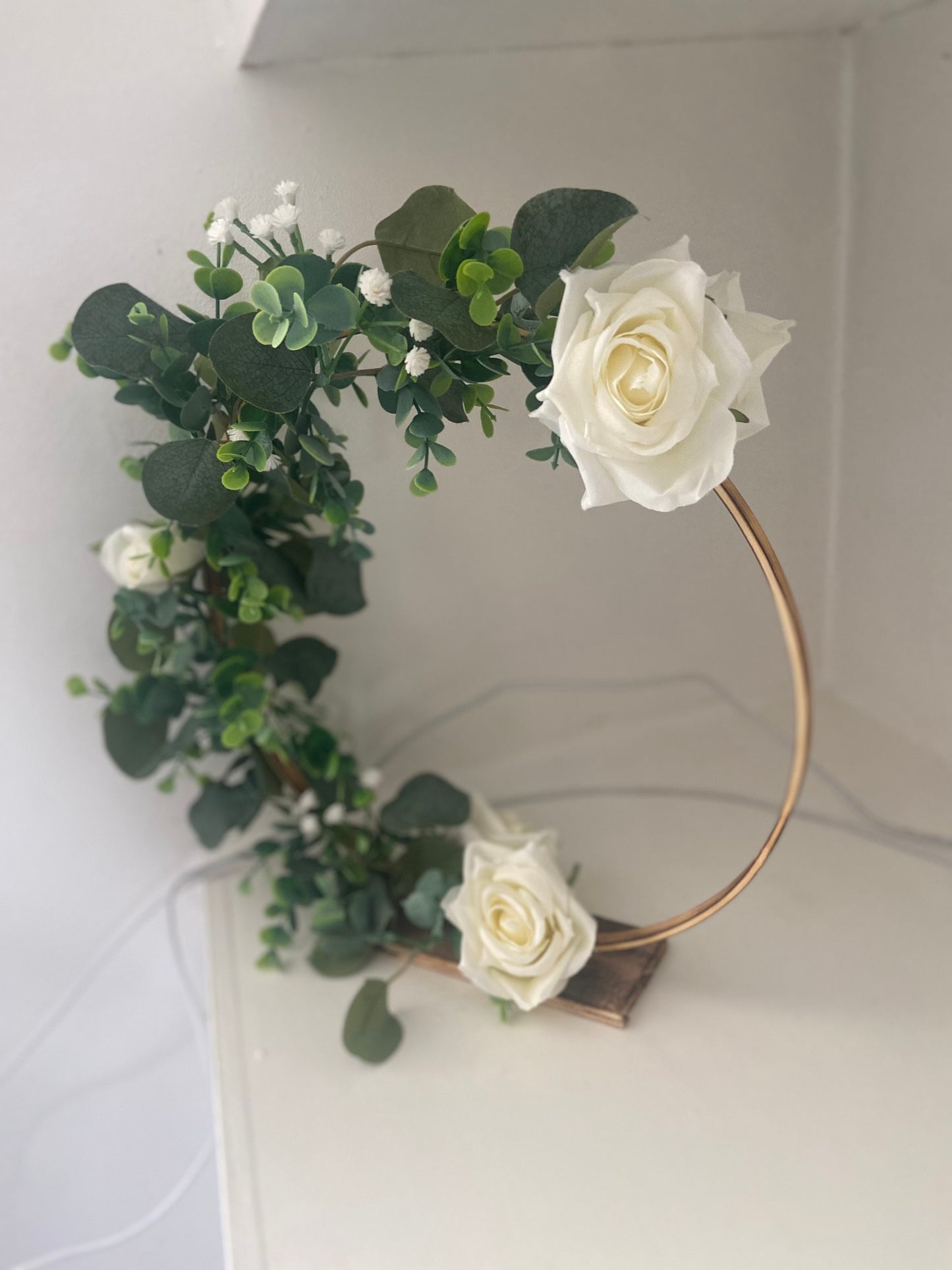 Beautiful rustic wedding centrepieces with eucalyptus, gypsophila and roses with hanging tealight holders